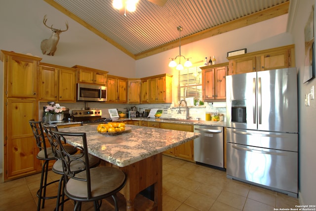 kitchen with stainless steel appliances, a center island, a sink, high vaulted ceiling, and light tile patterned floors