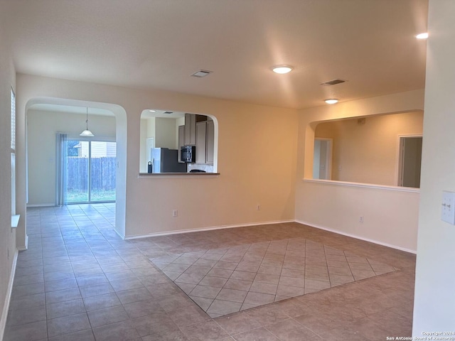 empty room featuring tile patterned floors