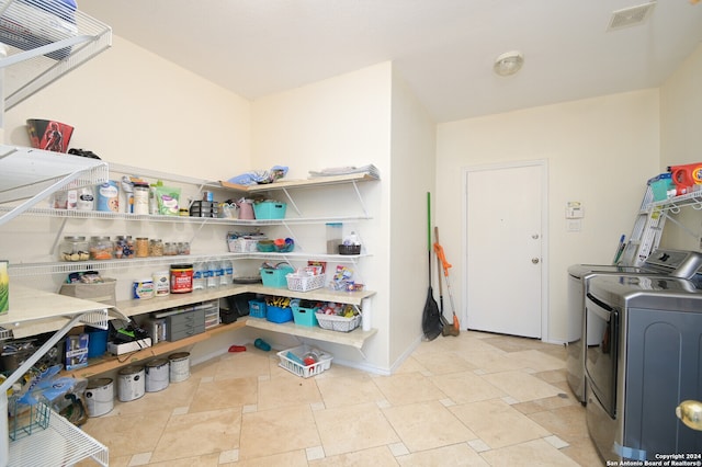 pantry featuring independent washer and dryer