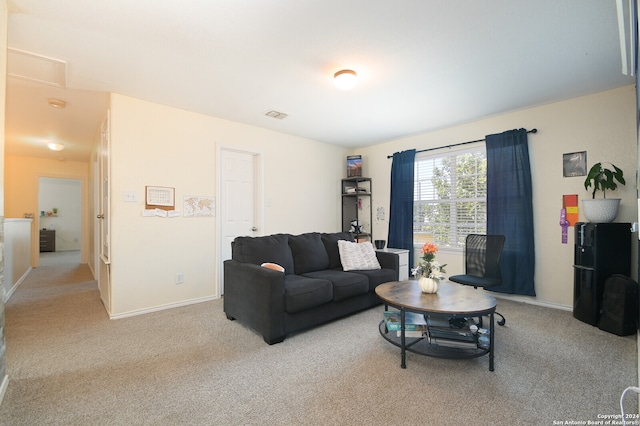 living room featuring light colored carpet