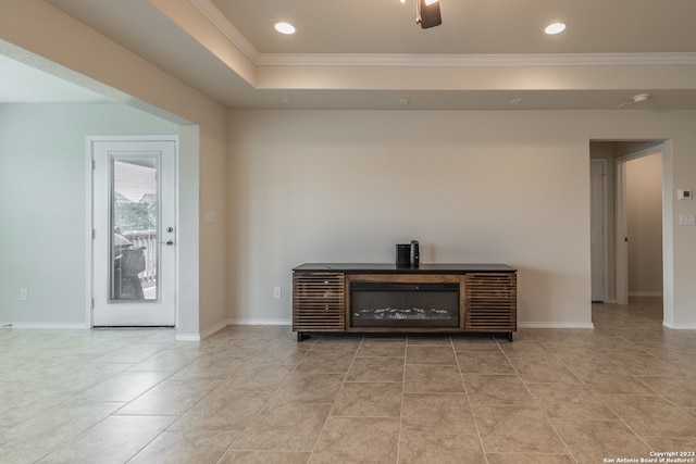 tiled living room featuring a tray ceiling