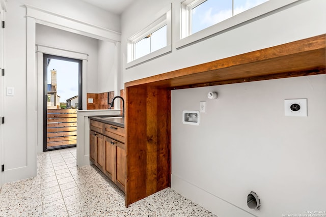 interior space featuring sink and light tile patterned floors