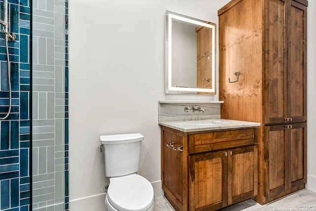 bathroom with tile patterned floors, toilet, and vanity