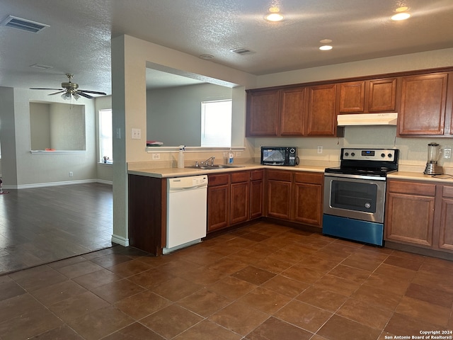 kitchen with ceiling fan, dark hardwood / wood-style floors, electric stove, dishwasher, and a textured ceiling