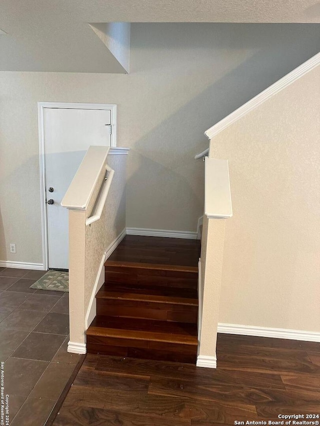 stairs with hardwood / wood-style floors