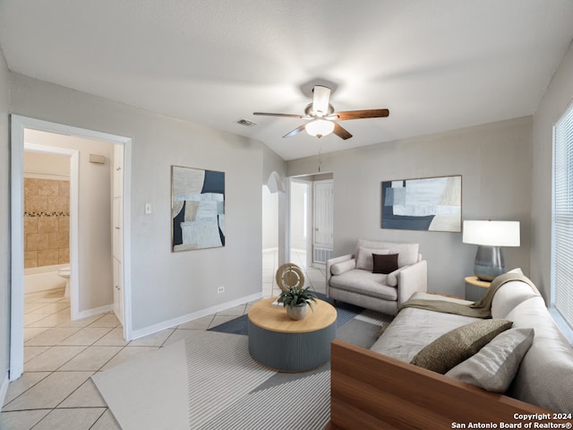 tiled living room featuring ceiling fan