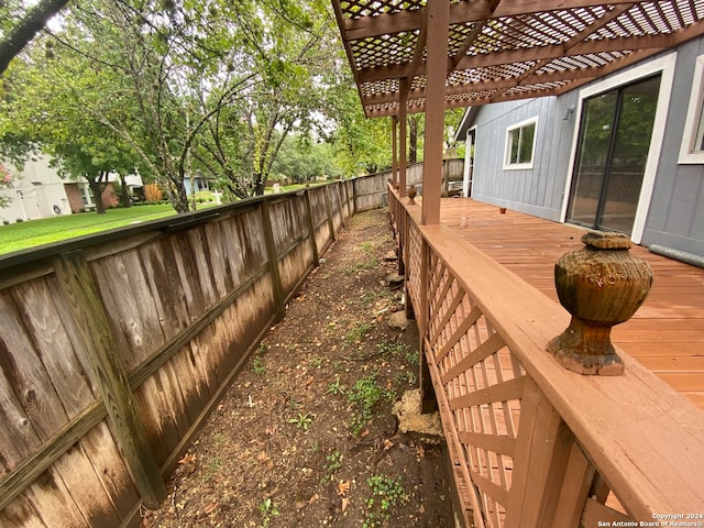 wooden terrace with a pergola