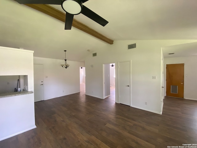 empty room featuring lofted ceiling with beams, dark hardwood / wood-style floors, and ceiling fan