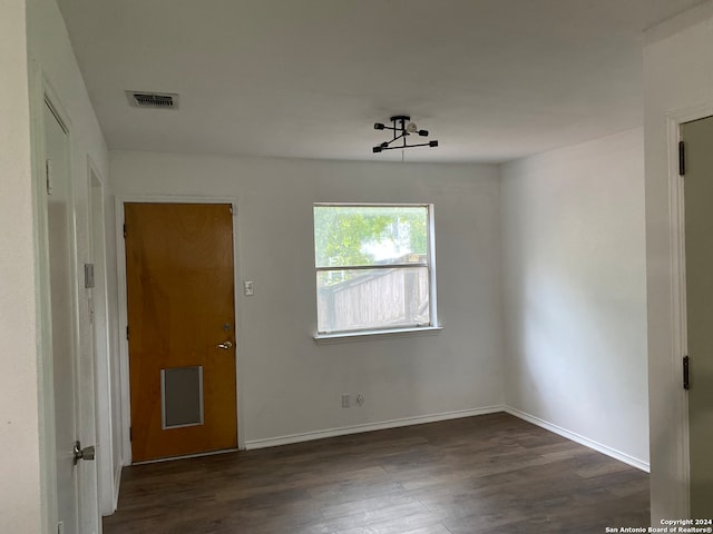 unfurnished room with dark hardwood / wood-style floors