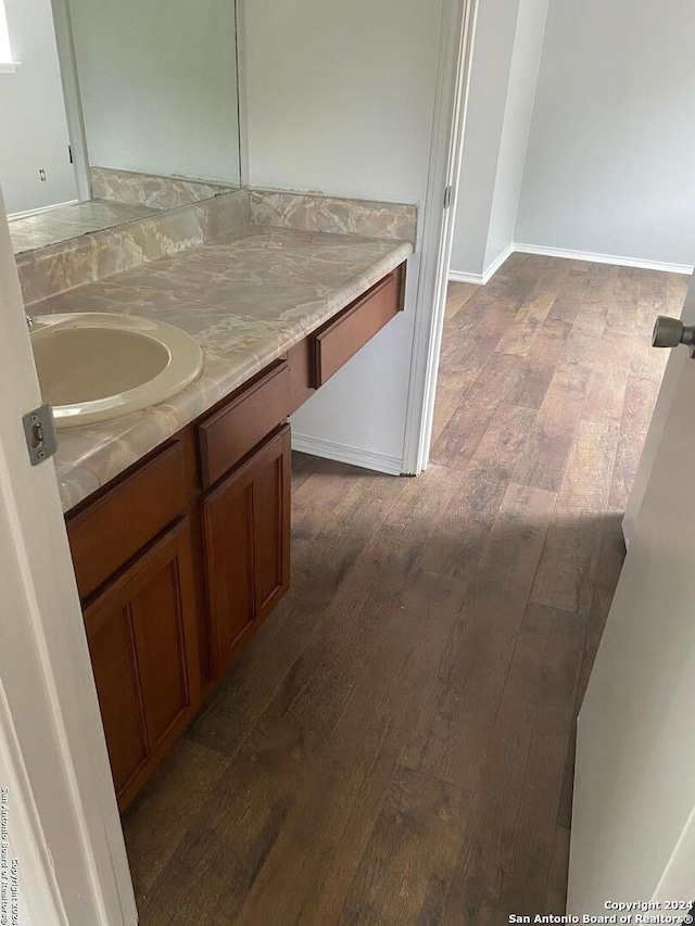 bathroom featuring vanity and hardwood / wood-style flooring