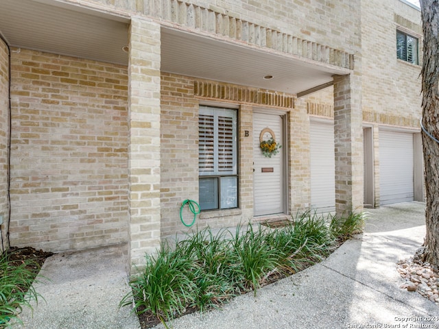 entrance to property featuring a garage