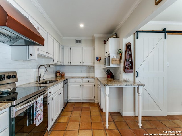 kitchen with light stone counters, stainless steel appliances, visible vents, white cabinetry, and extractor fan