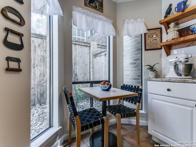 dining space featuring breakfast area and light tile patterned floors