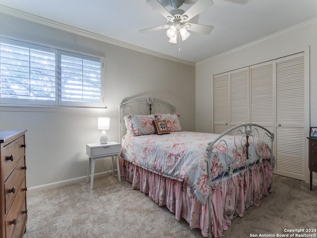 bedroom with light carpet, baseboards, a ceiling fan, crown molding, and a closet