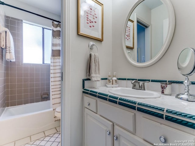 bathroom featuring shower / bath combo and vanity