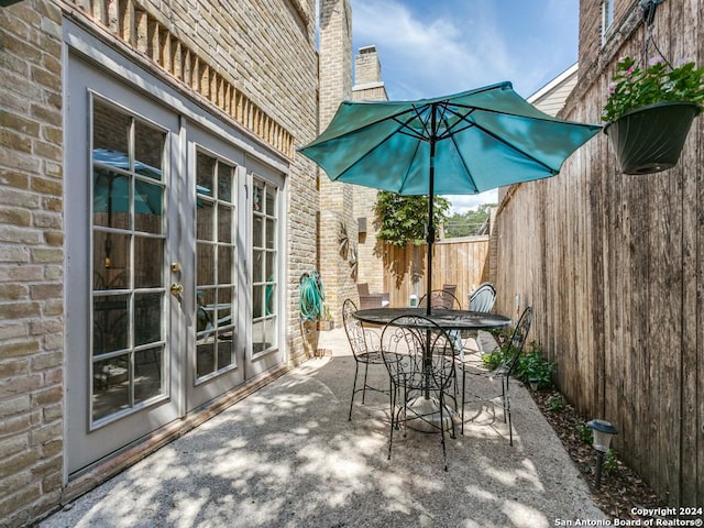 view of patio / terrace with outdoor dining space and fence