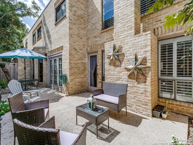 view of patio / terrace featuring fence