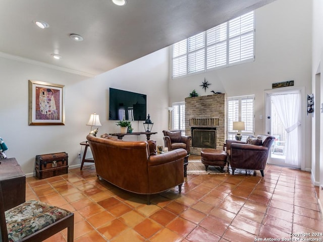 tiled living room with crown molding, a fireplace, recessed lighting, a towering ceiling, and baseboards