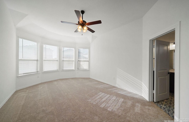 unfurnished room with light carpet, a ceiling fan, and baseboards