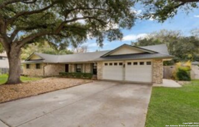 ranch-style home with a garage