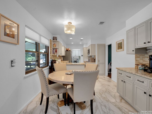 dining room with washer / clothes dryer