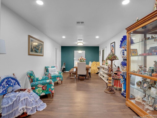 playroom featuring hardwood / wood-style floors and beamed ceiling