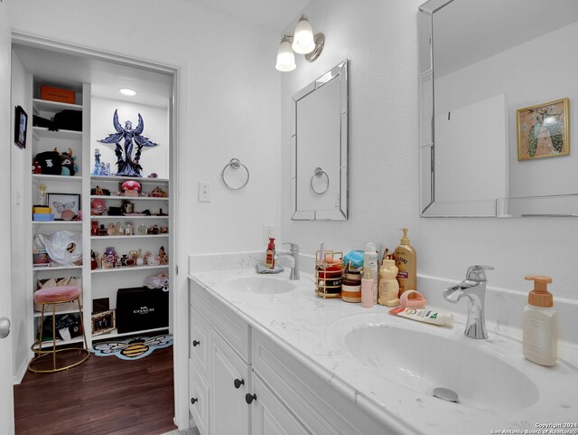 bathroom featuring vanity, toilet, and wood-type flooring