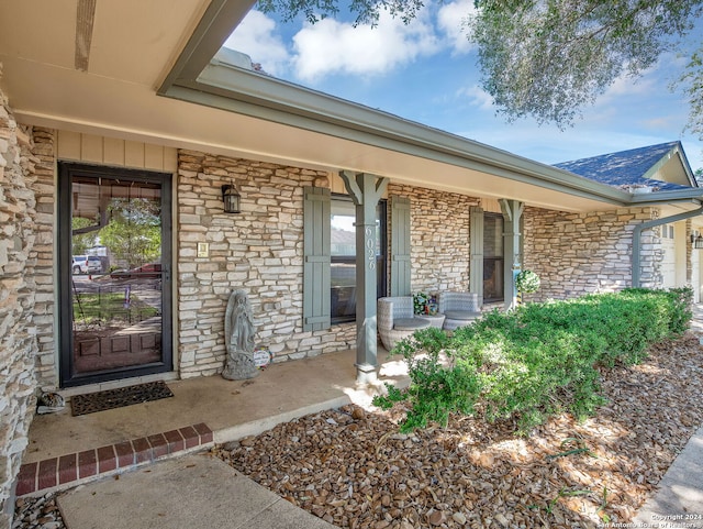 property entrance featuring covered porch