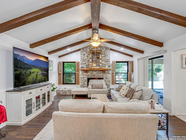 living room with a fireplace, vaulted ceiling with beams, ceiling fan, and dark wood-type flooring