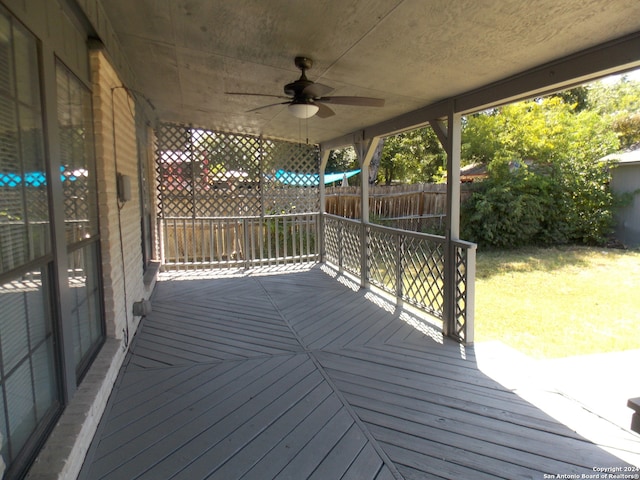 wooden terrace featuring ceiling fan