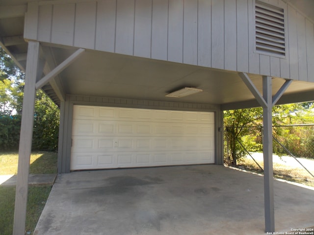 garage featuring wooden walls