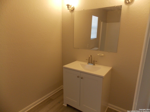 bathroom featuring vanity and wood-type flooring