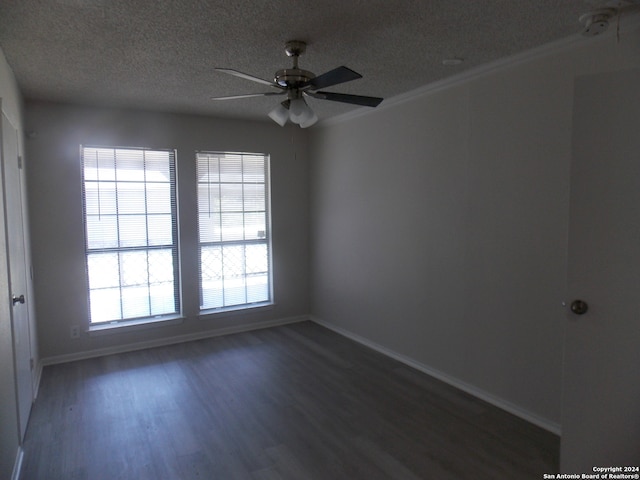 spare room with ceiling fan, dark hardwood / wood-style floors, ornamental molding, and a textured ceiling