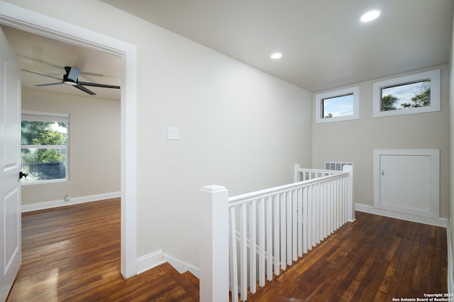 corridor with dark hardwood / wood-style floors