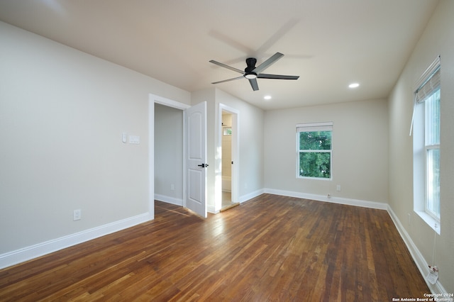 spare room featuring ceiling fan and dark hardwood / wood-style floors