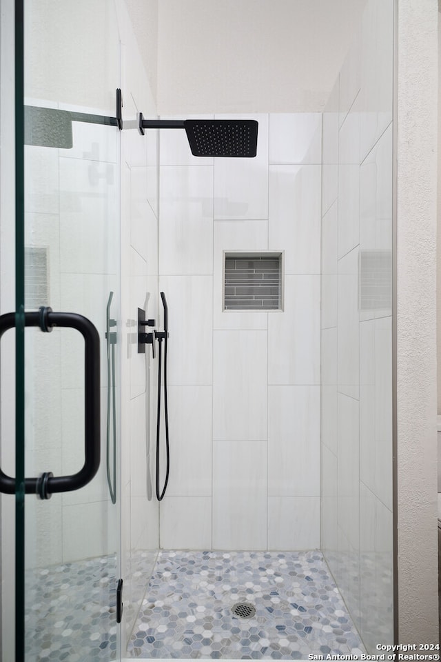 bathroom featuring an enclosed shower