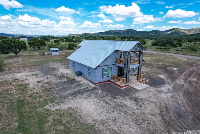 birds eye view of property featuring a mountain view