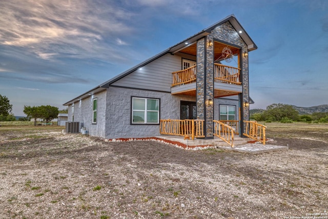 136 Cardinal Dr, Camp Wood, TX 78833 - view of front facade with a balcony and central AC unit