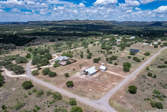 birds eye view of property featuring a mountain view