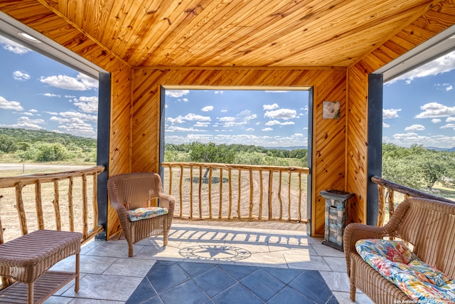 sunroom / solarium with wood ceiling and plenty of natural light