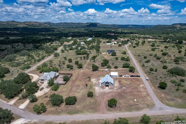 birds eye view of property with a mountain view