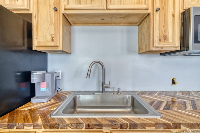 kitchen featuring sink and light brown cabinets