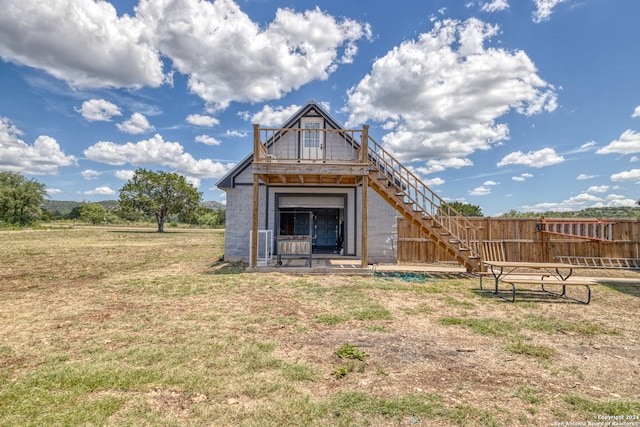 view of outbuilding featuring a yard