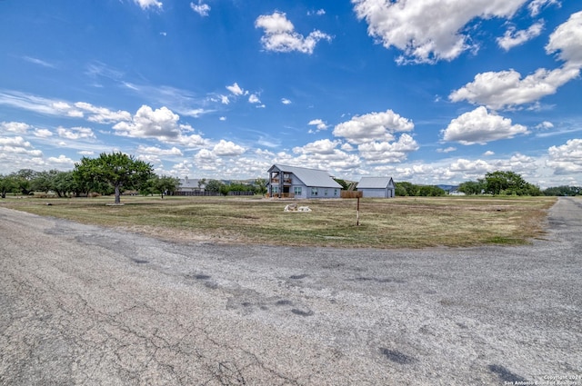 136 Cardinal Dr, Camp Wood, TX 78833 - view of street with a rural view