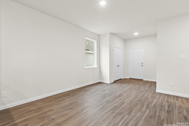 unfurnished bedroom with hardwood / wood-style floors