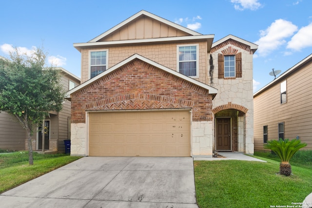 view of front of house with a front lawn and a garage