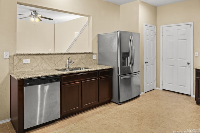 kitchen with backsplash, stainless steel appliances, sink, ceiling fan, and light tile patterned flooring