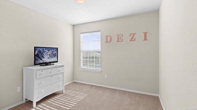 carpeted bedroom with baseboards