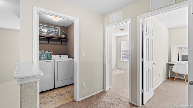 laundry area with carpet floors, laundry area, visible vents, and separate washer and dryer