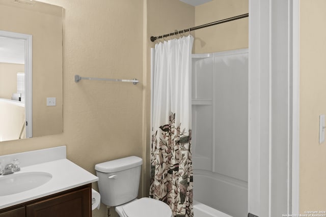 full bathroom featuring shower / bath combo, toilet, and vanity